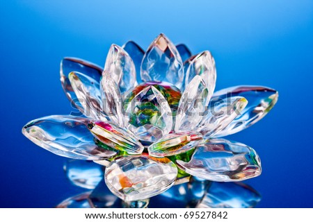 glass lotus flower on blue