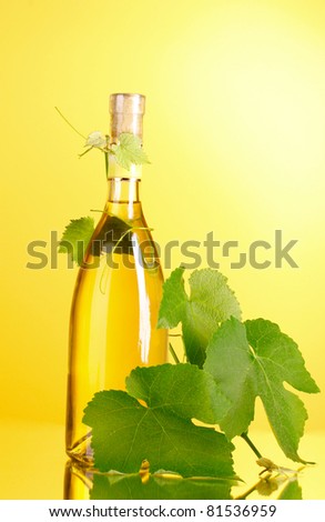 White wine on yellow background
