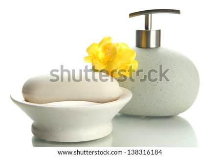 Bottle and soap-dish with soap isolated on white