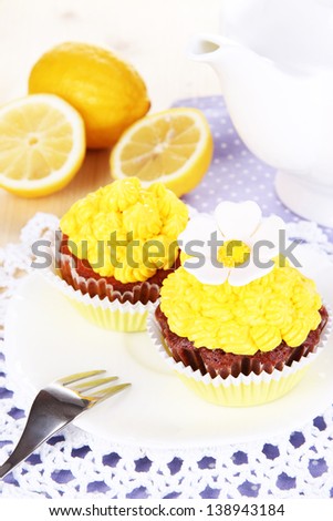 Beautiful lemon cupcakes on dining table close-up