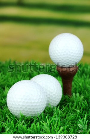 Golf balls on grass outdoor close up