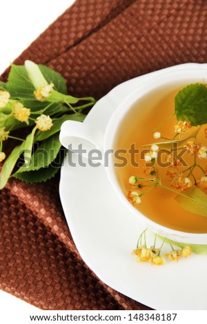 Cup of tea with linden on napkin