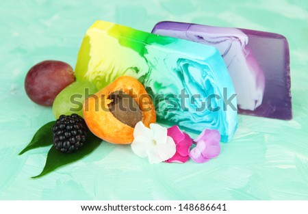 Pieces of handmade soap with natural oils and fruits flavor, on bright background