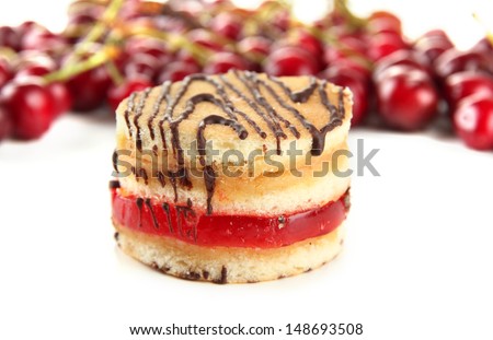 Tasty biscuit cake and berries isolated on white