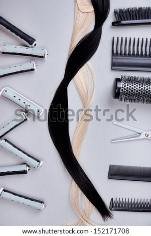 Professional hairdresser tools on gray background