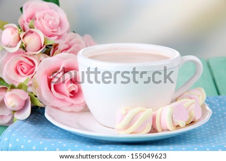 Cocoa drink on wooden  table, on light  background