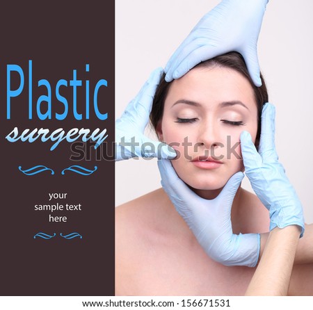 Rubber gloves touching face of young woman close up