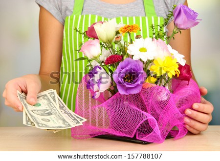 Florist makes flowers bouquet