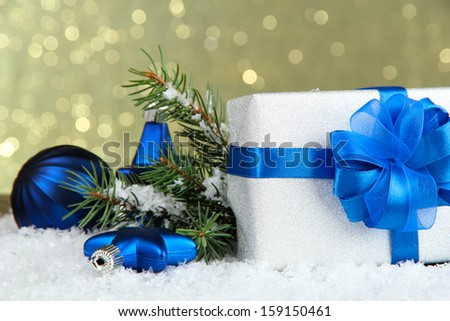 Beautiful bright gift and christmas decor, on shiny background