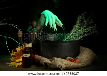 Witch in scary laboratory on dark color background
