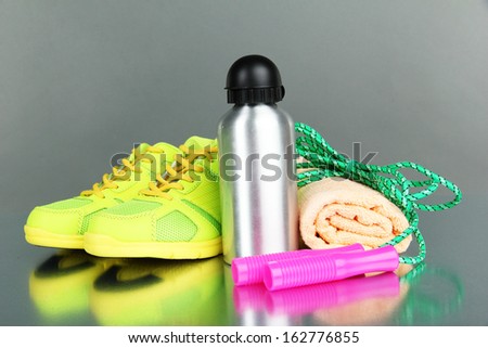 Different tools for sport on grey background