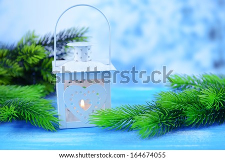 Christmas lantern, fir tree and decorations  on light background