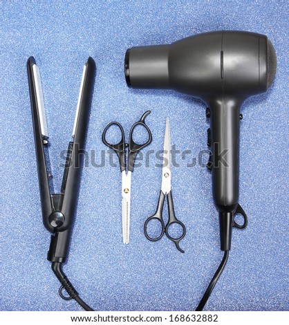Hairdressing tools on blue background