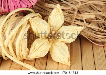 Decorative straw for hand made and flower of straw, on wooden background