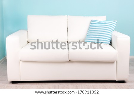 White sofa in room on blue background