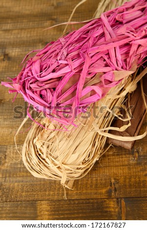 Decorative straw for hand made, on wooden background