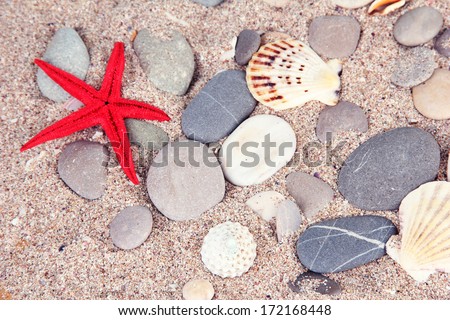 Sea stones on sand background