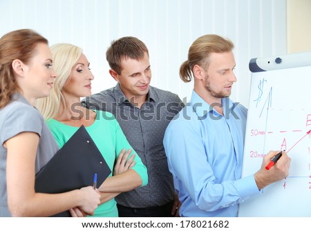 Business team working in office near whiteboard
