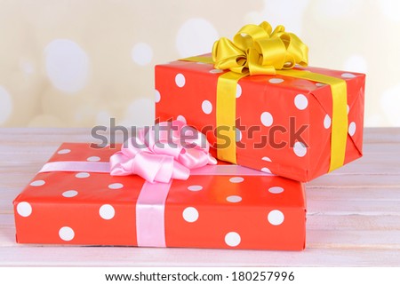 Gift boxes on table on light background