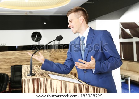 Businessman is making speech at conference room