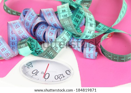 Measuring tape and scales close-up