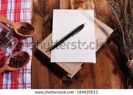 Blank recipe book on wooden table background