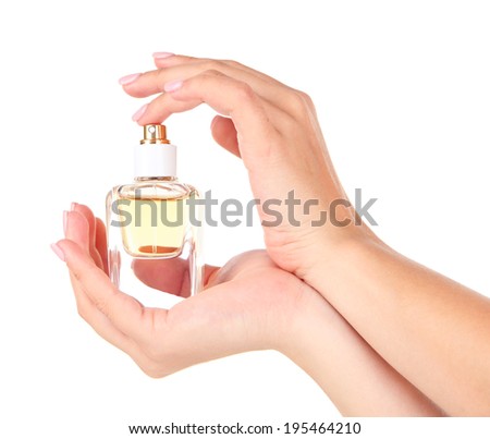 Bottle of perfume in hand isolated on white