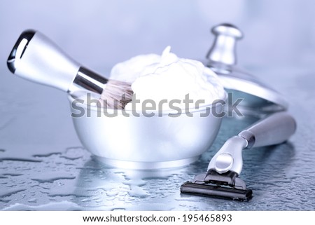 Male luxury shaving kit on table on bright background