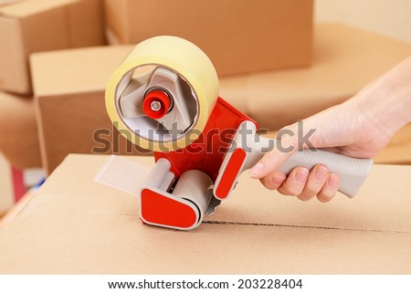 Packaging parcels with dispenser close-up