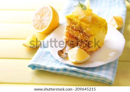 Tasty lemon dessert on wooden table