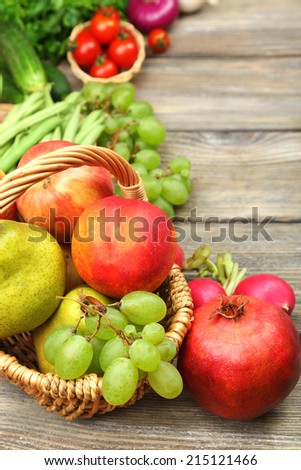 Summer frame with fresh organic vegetables and fruits on wooden background