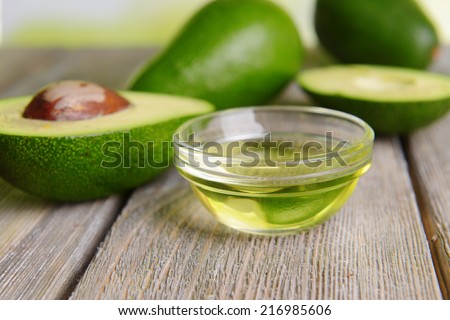 Avocado oil on table close-up