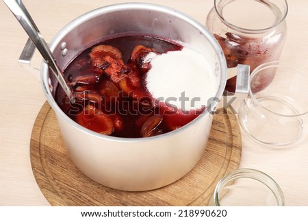 Cooking delicious drain jam in kitchen