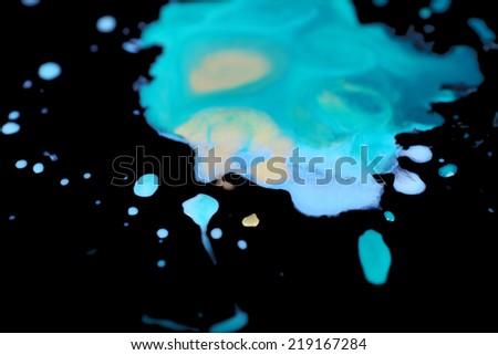 Spilled paint isolated on black