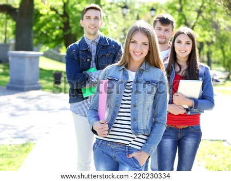Happy students in park