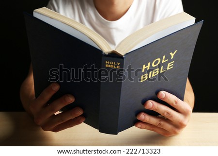 Man reading Bible close up
