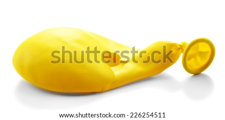 Popped yellow balloon isolated on white