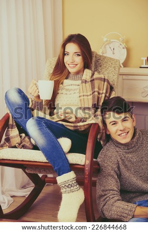 Happy couple relaxing at home