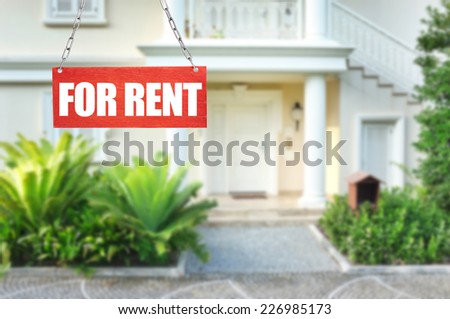 Real estate sign in front of new house for rent