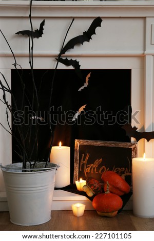 Halloween composition on fireplace closeup