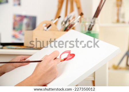 Artist painter on canvas in art studio
