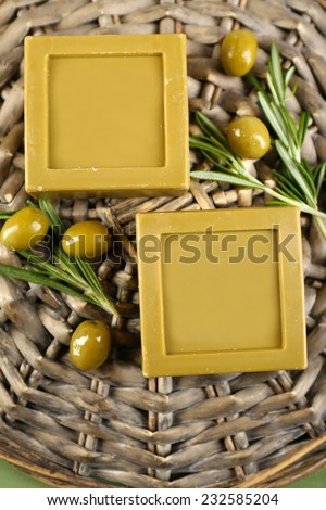 Bars of natural soap  with olive oil on wicker mat background