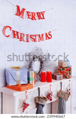 Fireplace with Christmas decoration and inscription \