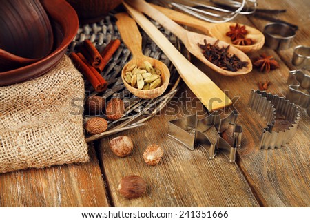 Retro kitchen utensils for baking on rustic wooden background