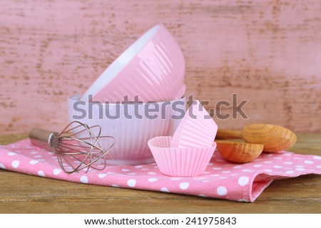 Modern kitchen utensils for baking on color wooden background