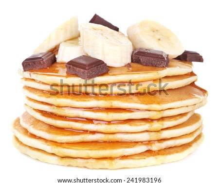 Stack of delicious pancakes with chocolate, honey and slices of banana on plate isolated on white