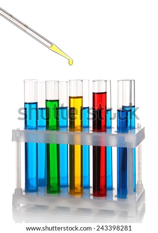Pipette with drop of color liquid over container tubes isolated on white