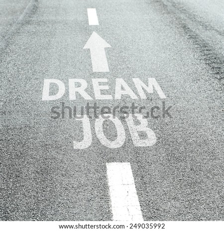 Text Dream Job with arrow marking on road surface