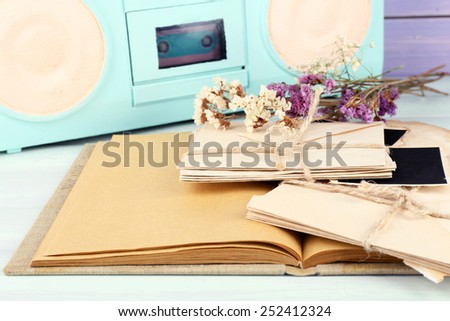 Vintage memories with dry flowers on wooden background