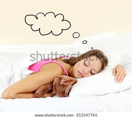 Beautiful sleeping young woman and space for text in cloud